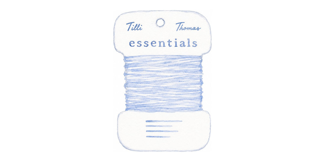 Watercolor illustration of a Tilli Thomas thread card wound with pale blue thread on a white background