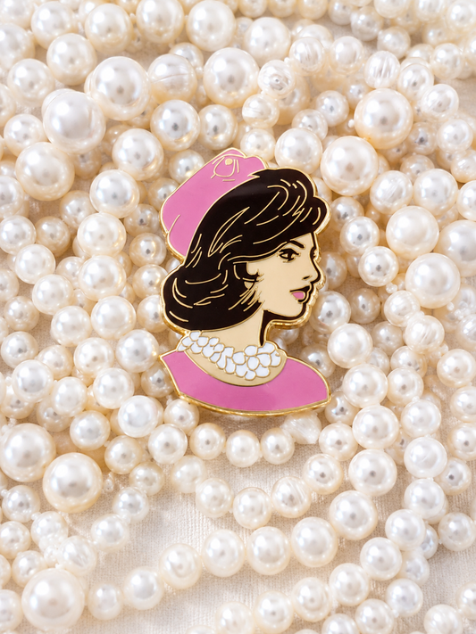 Clutch the Pearls needleminder resting on strands of pearls