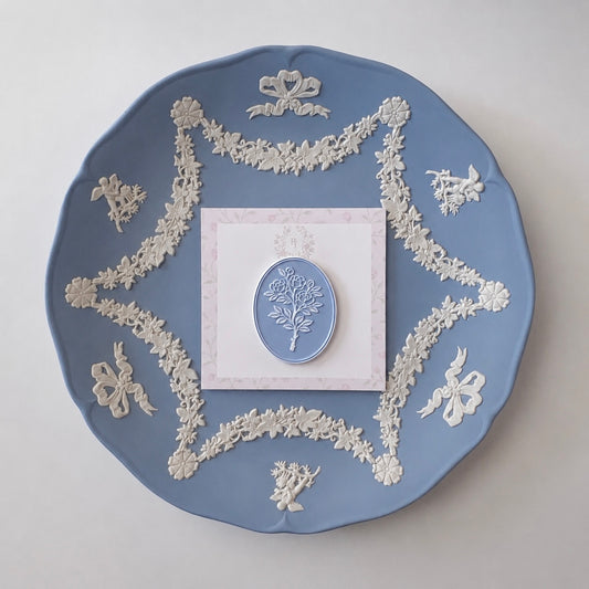 Antique blue rose cameo needleminder on a card, styled on blue jasperware