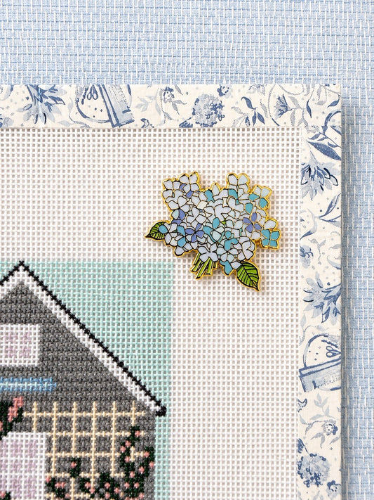 Hydrangea Bloom needleminder holding on a needlepoint canvas