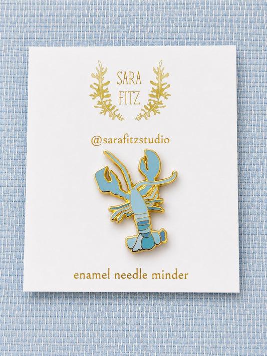 Sara Fitz blue lobster enamel needleminder on its card